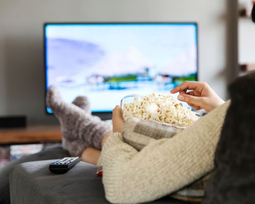 watching tv with popcorn