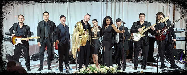 9 Members of Resonance Band in formal dress, onstage