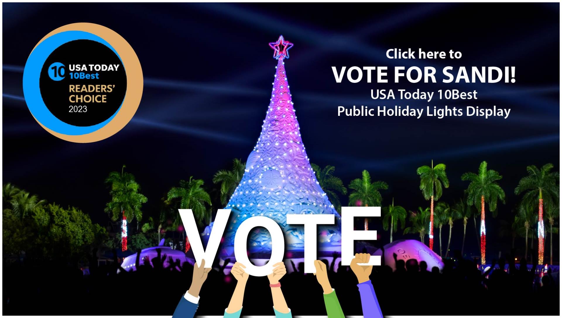 Brilliantly lit 700 ton holiday sand tree against night sky. VOTE in bold white letters.  Logo for USA Today 10Best.  Copy reads: Click here to vote for Sandi! USA Today 10Best Public Holiday Lights Display