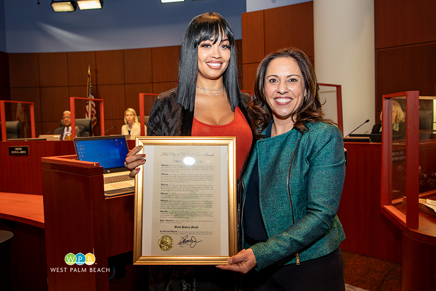 City Commissioner Christina Lambert presents to Buera (Eminent) Albritton - a