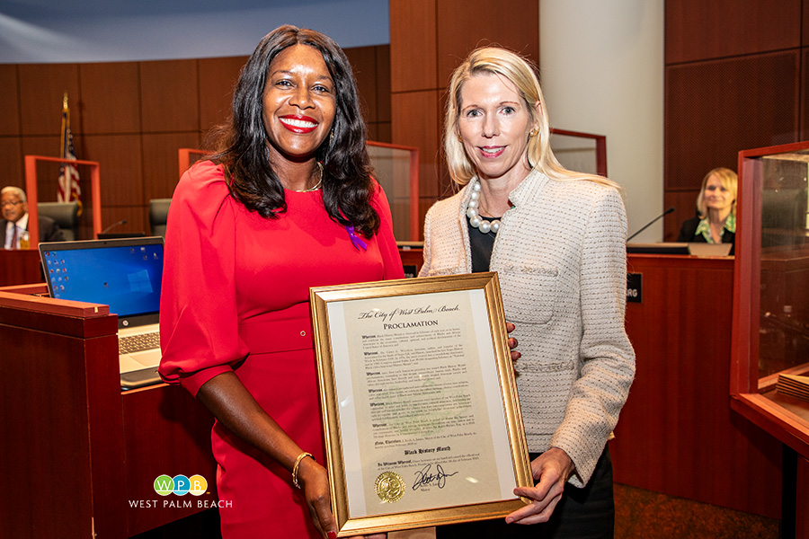 City Commissioner Christy Fox presents to Rosalyn Sia Baker-Barnes, Esq - a