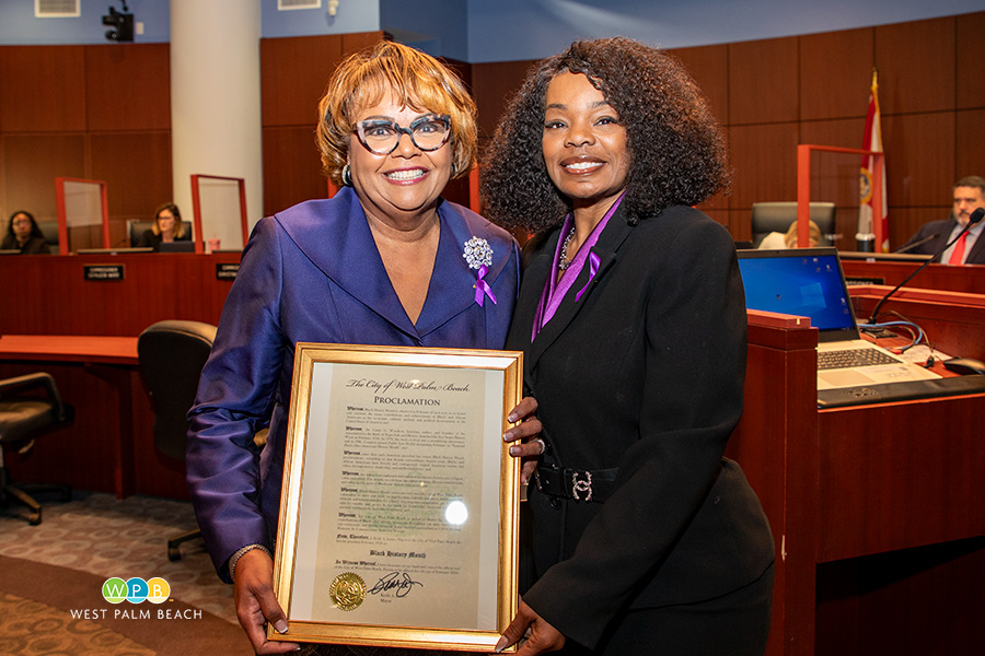 Commission President Shalonda Warren presents to Judge Sheree Cunningham - a