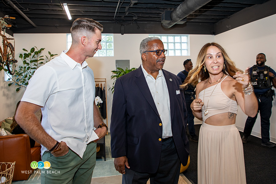 Mayor Keith A. James chats with MVMNT owners Nick Hasson and Natalie Addison - a