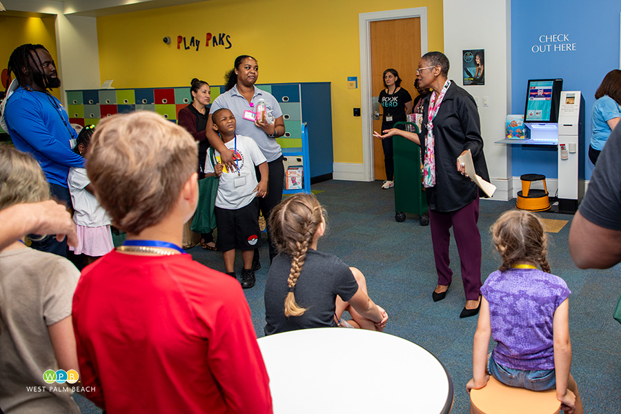 CA Faye Johnson speaks with the younger children - a