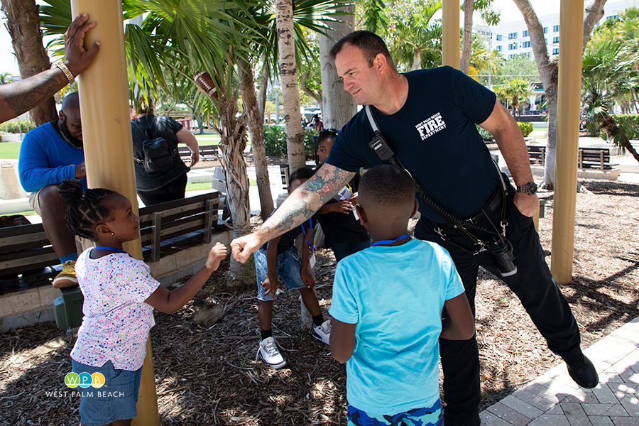 Firefighter fist bump with a child