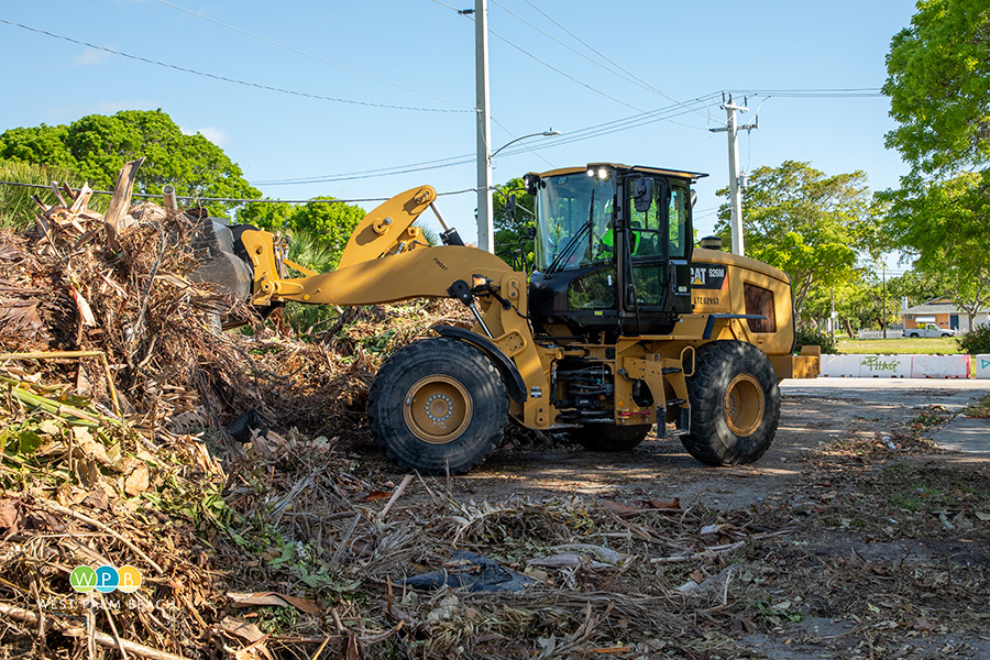 payloader cleaning an area - a