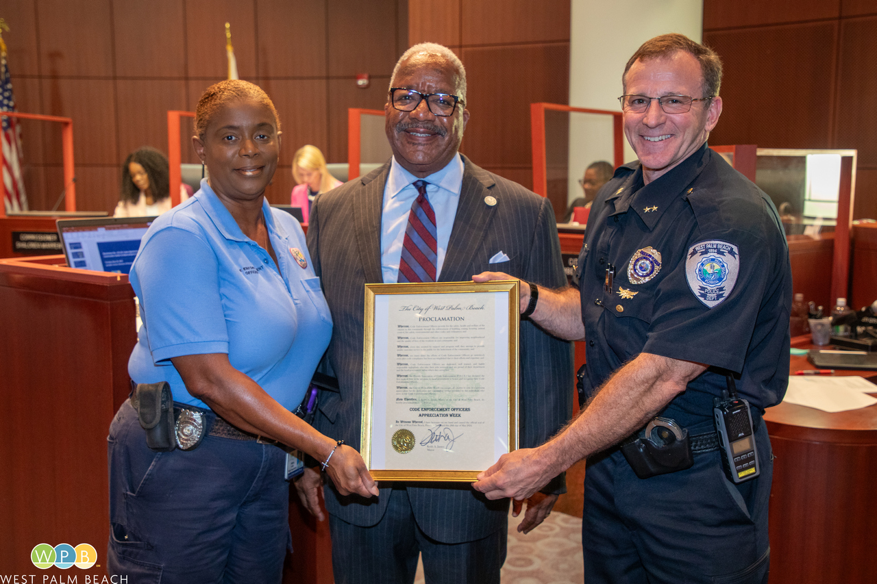 Code Enforcement Officer Valerie Luster, left, Mayor Keith A. James, center, and Assistant Police Chief Anthony Spatara, right Code Enforcement Officers Week 5-28-24
