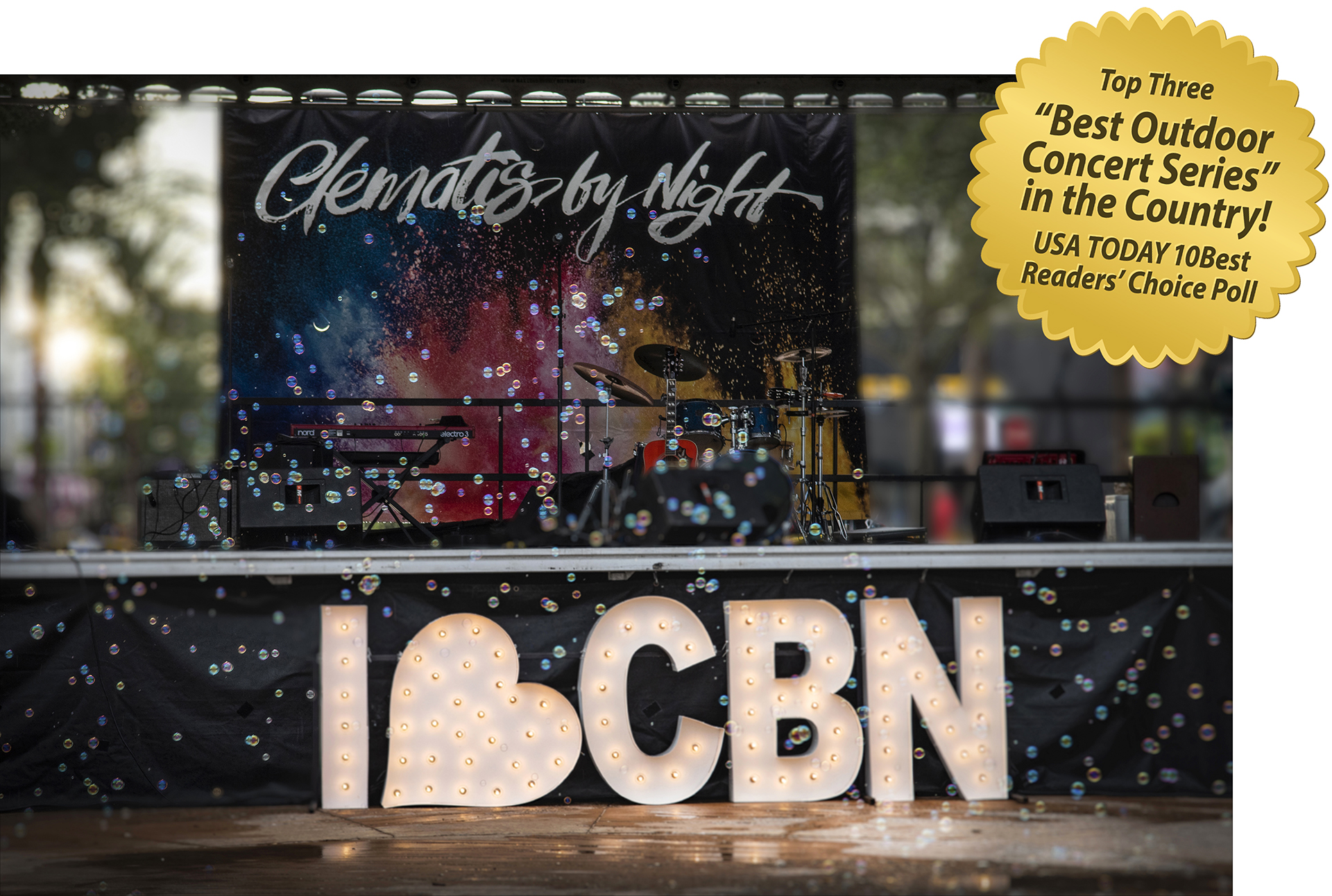 Clematis by Night stage with "I heart CBN" illuminated letters stage front.  Headline in a gold seal: Top 3 Best Outdoor Concert Series in the Country! USA Today 10 Best Readers' Choice Poll