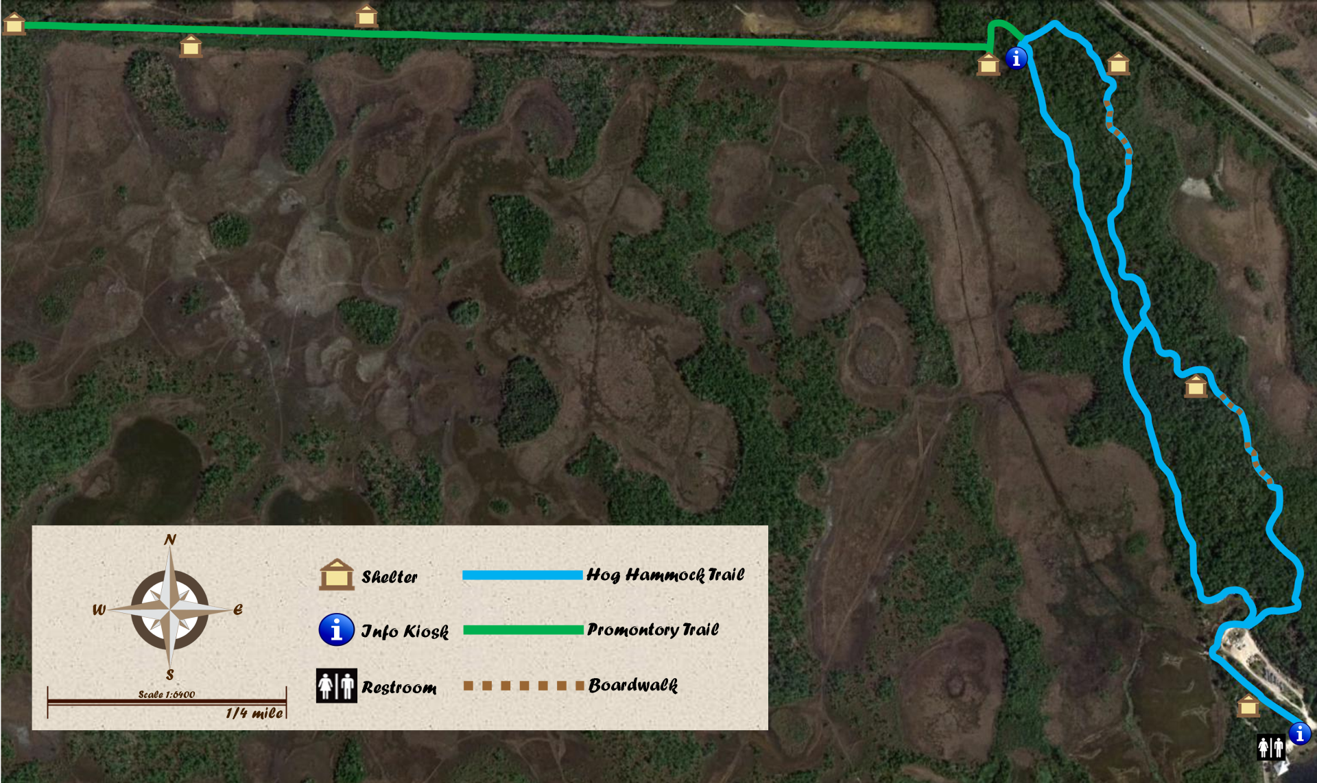 hog hammock trail map showing the 2 mile hog hammock trail loop in blue and the green promontory trail extended westward from the northern tip of hog hammock for 1 mile.  Public restrooms are shown at the southern parking area near the trailhead, and a hut symbol shows shelters along the trail.