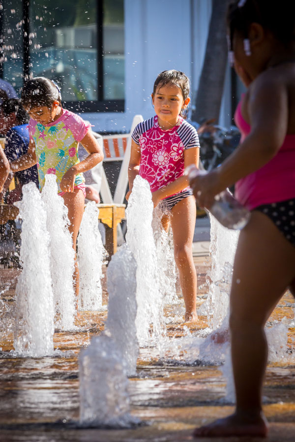 Photo of children playing in Centennial Square fountain