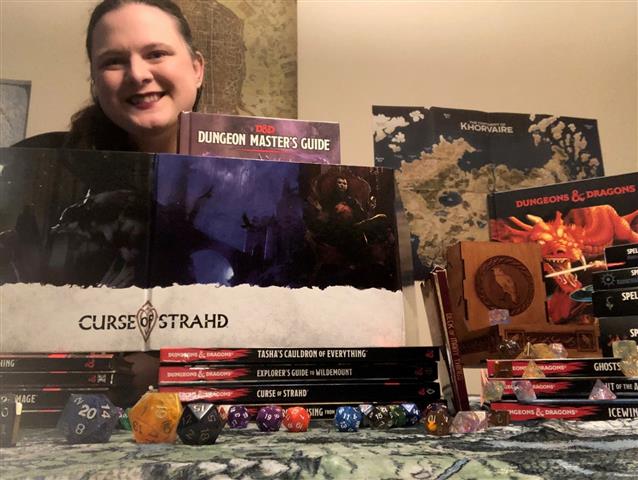 Photo of Antoinette with DND books and dice