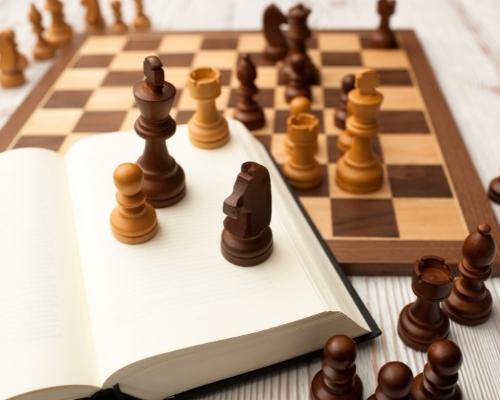 Chess pieces on a book