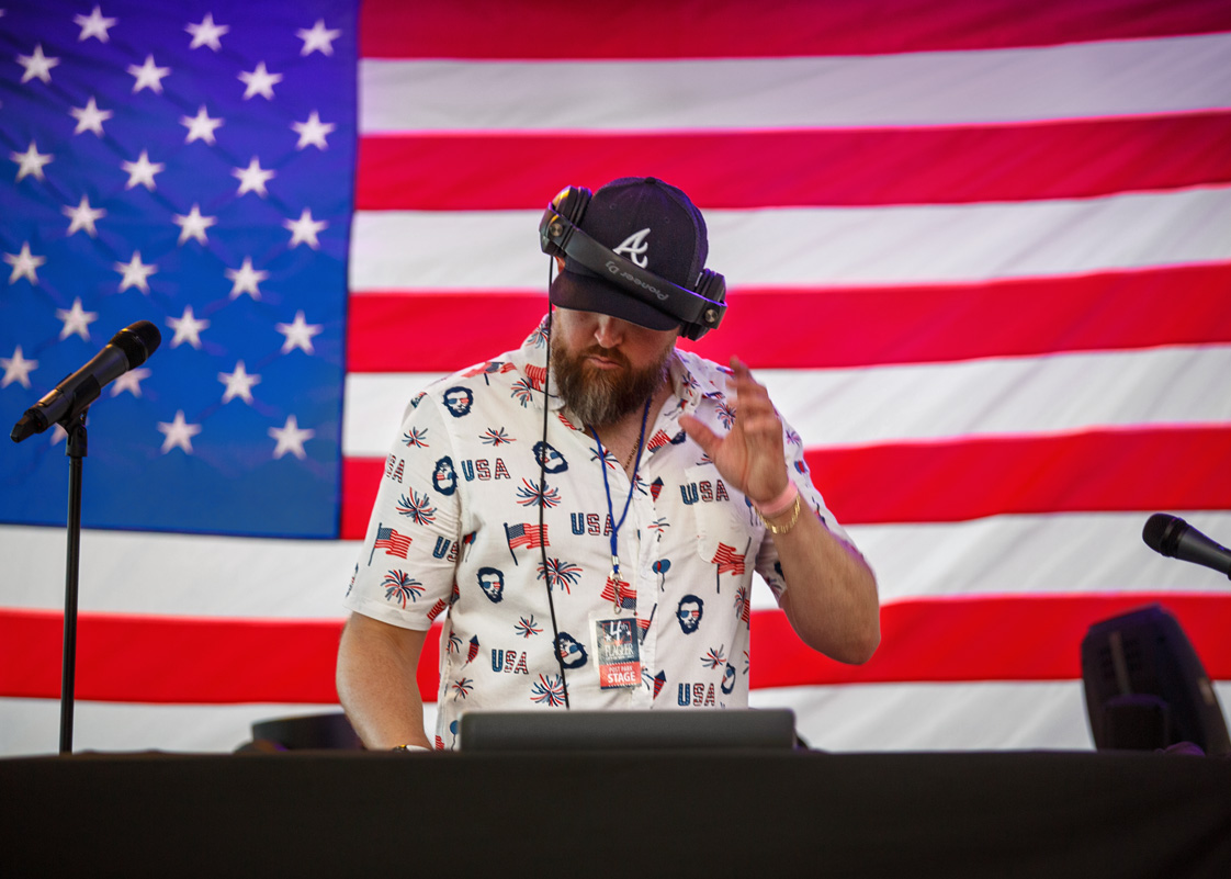 Disk Jockey in front of American Flag