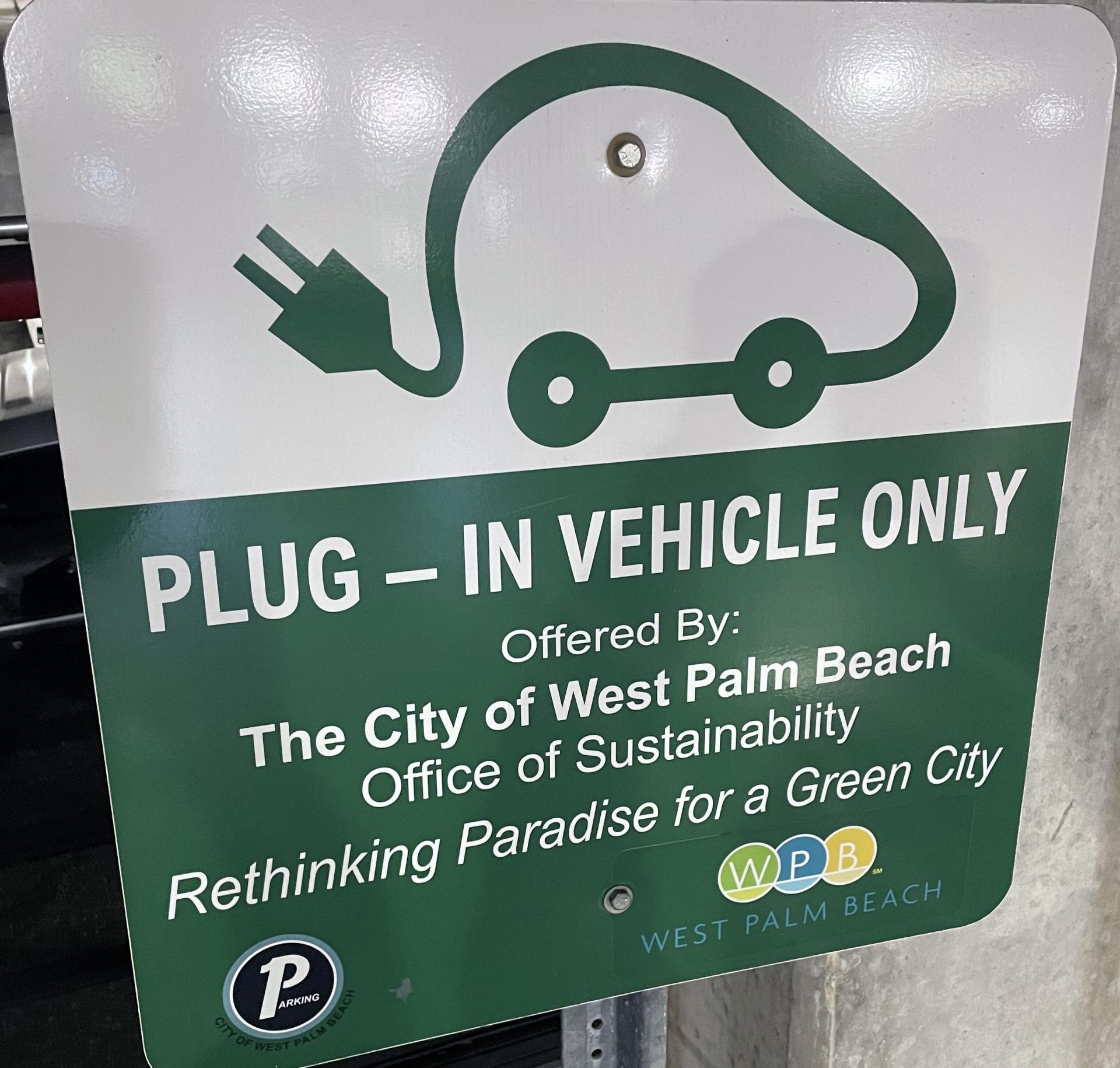 Rethinking Paradise for a Green City electric vehicle charging station sign