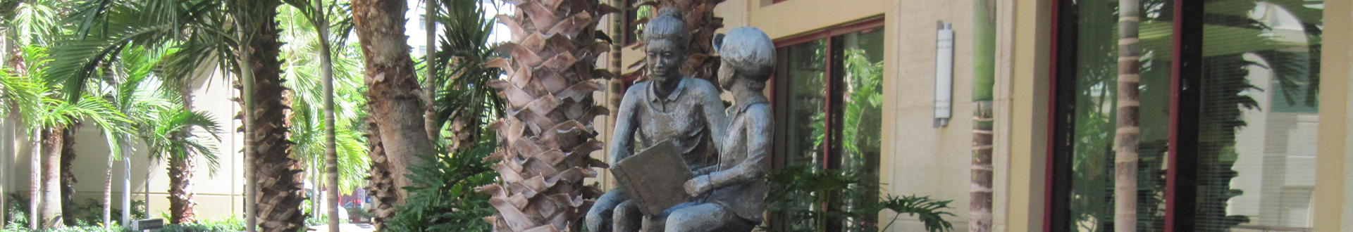 Reading statue in library courtyard