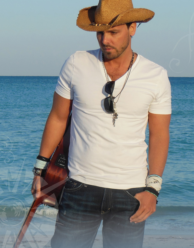 Tim Charron on the Beach in Cowboy Hat holding Guitar