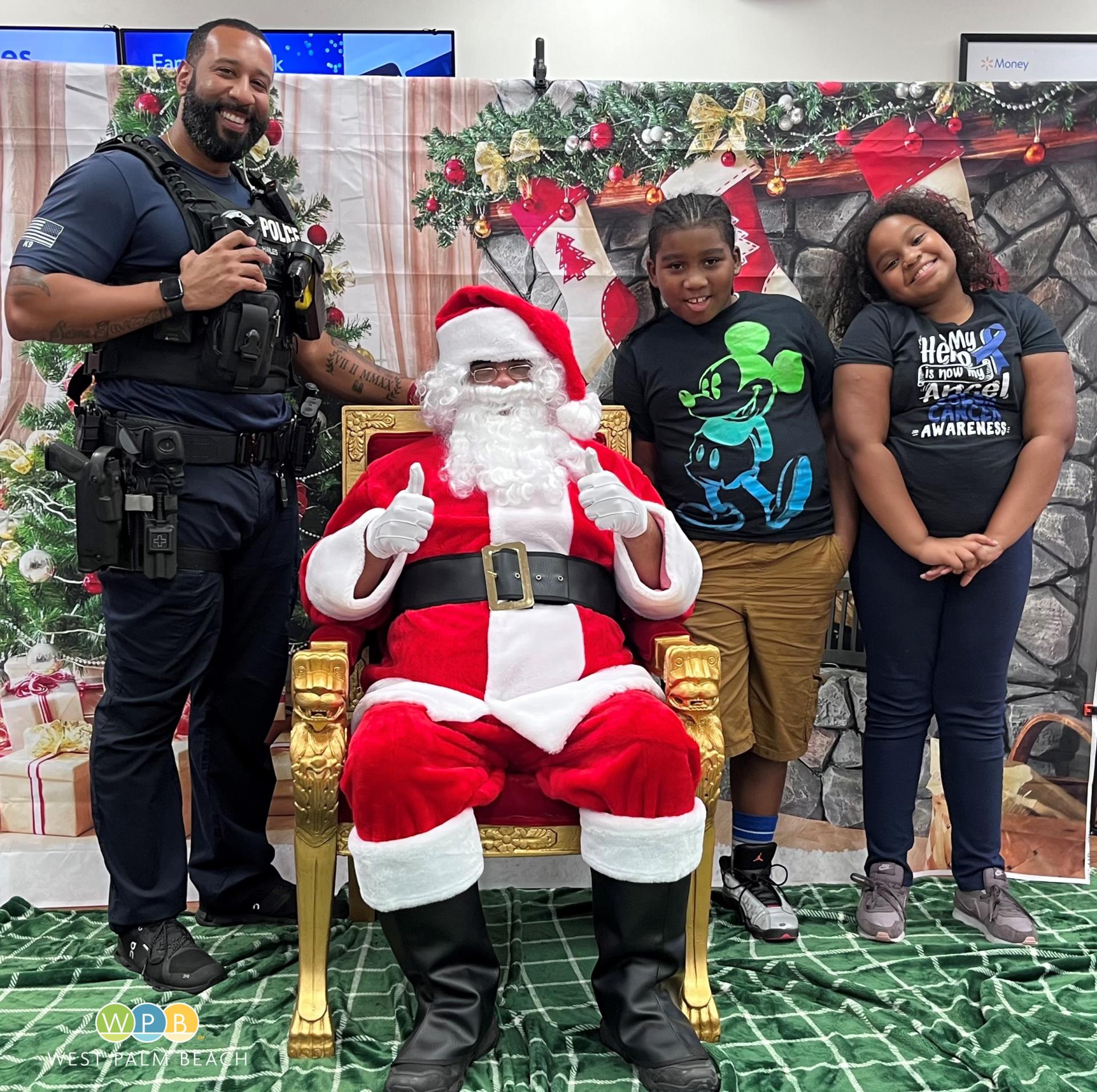 Shop with a Cop - Santa and happy shoppers