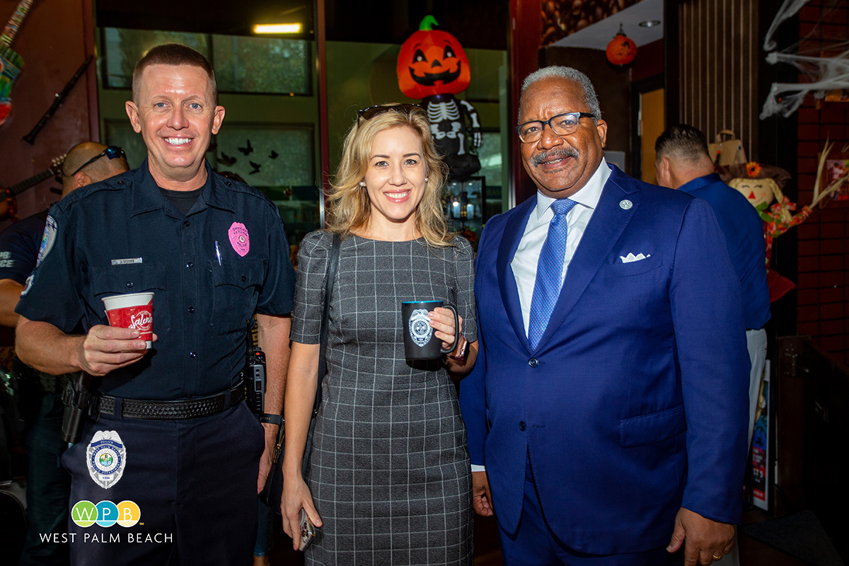 Officer Seth Buxton, participant, and Mayor Keith A. James