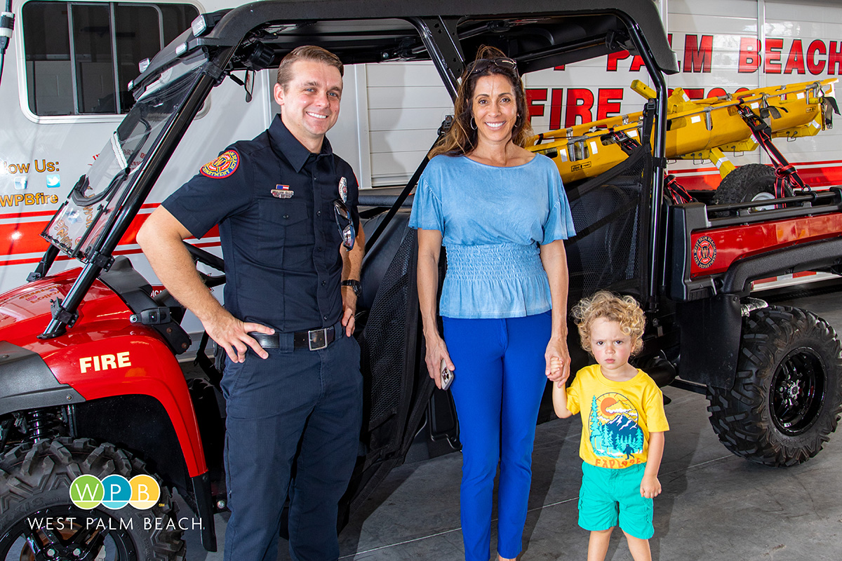 Little Roman Edelheit checks out a fire ATV with mom and Firefighter William Bass